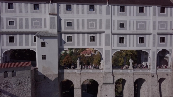 People Walking on Cesky Krumlov Castle Bridge