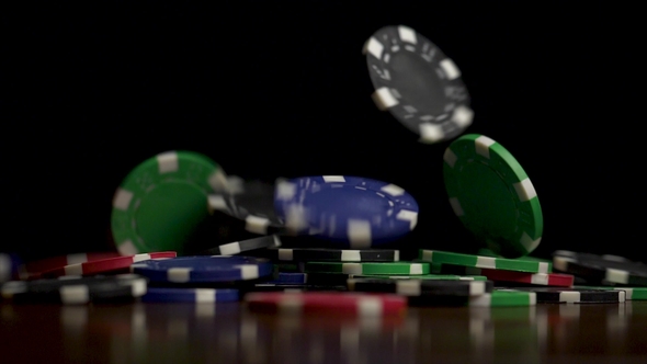 Falling Poker Chips Isolated on Black Background