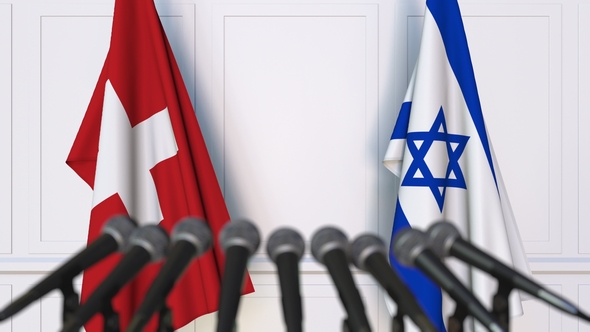Flags of Switzerland and Israel at International Press Conference alt