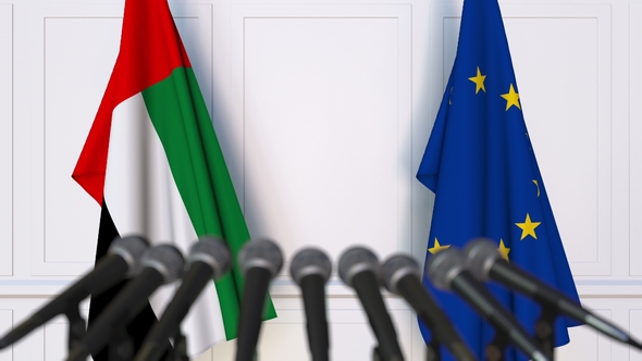 Flags of the UAE and the European Union at International Press Conference alt