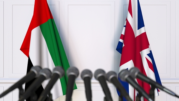 Flags of the UAE and The United Kingdom at International Press Conference alt