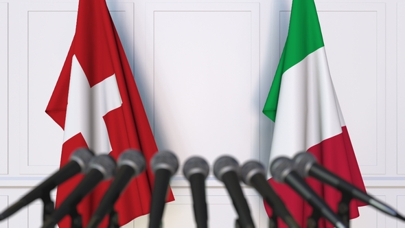 Flags of Switzerland and Italy at International Press Conference alt