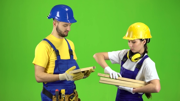 Pair of Builders Choose Wooden Boards