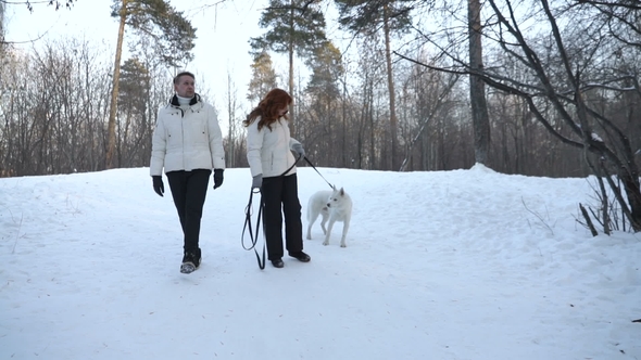 Couple with Cute Dog in Forest