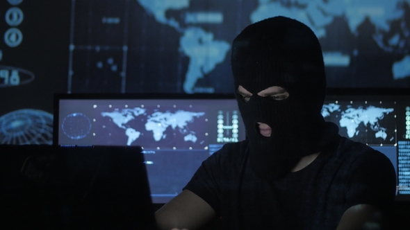 Dangerous Hacker in the Mask Tries To Enter the System