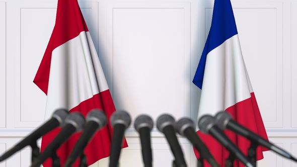 Flags of Peru and France at International Press Conference alt