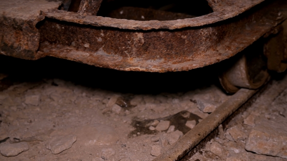 the Old, Rusted, Trolley Slowly Goes To in Dark a Cave
