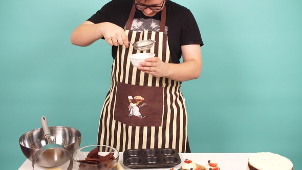 Skilled Confectioner Adding Ingredients for Preparation of Dough, Baking Cake.