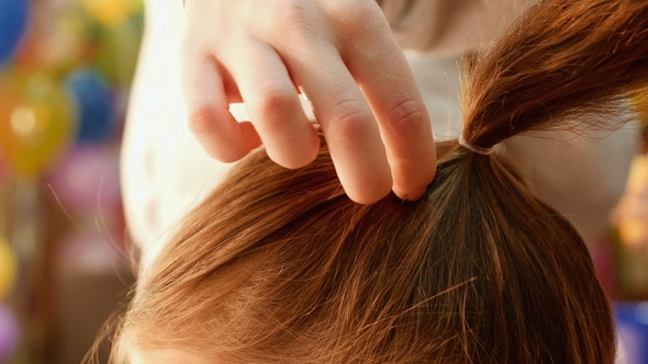 Female Model Getting Her Hair Dressed