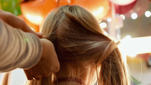 Female Model Getting Her Hair Dressed