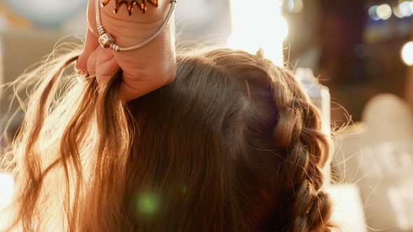 Female Model Getting Her Hair Dressed