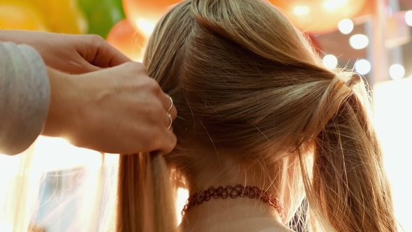 Female Model Getting Her Hair Dressed