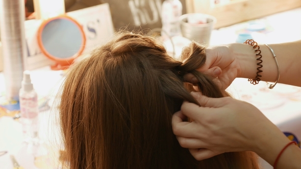 Female Model Getting Her Hair Dressed