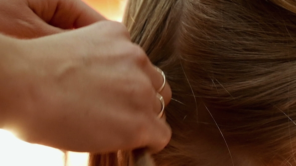 Female Model Getting Her Hair Dressed