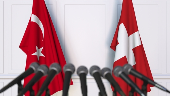 Flags of Turkey and Switzerland at International Press Conference alt
