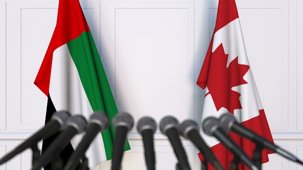 Flags of the UAE and Canada at International Press Conference alt
