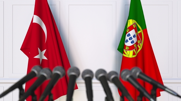 Flags of Turkey and Portugal at International Press Conference alt