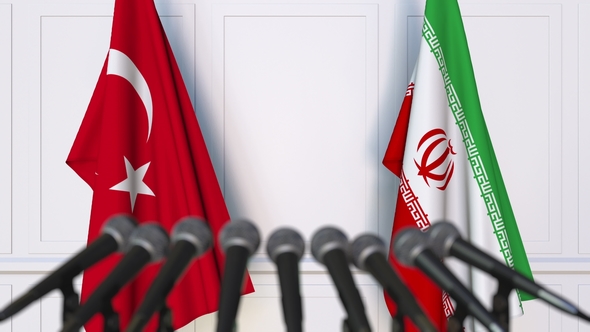Flags of Turkey and Iran at International Press Conference alt