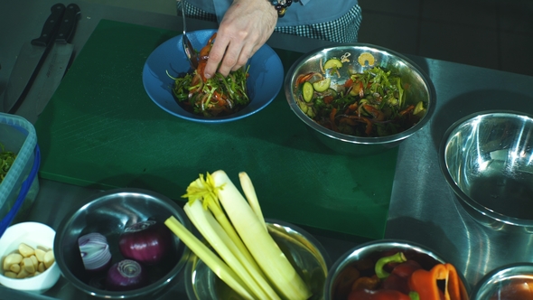 the Chef Lays Out the Salad Plates