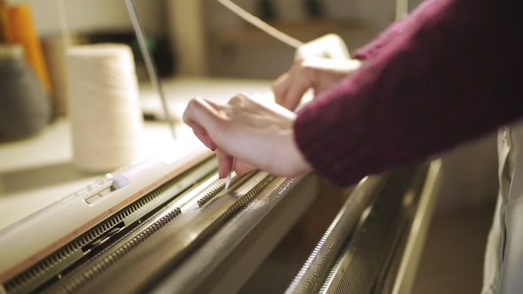 Female Hands Working on Weaving Machine in Sewing Workshop