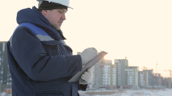 Foreman With Pad at Major Construction Project