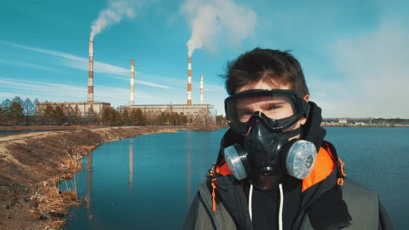 Portrait of a Young Man in a Respirator or Gas Mask