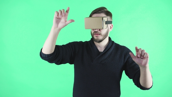 Man Using Vr Headset on the Green Background