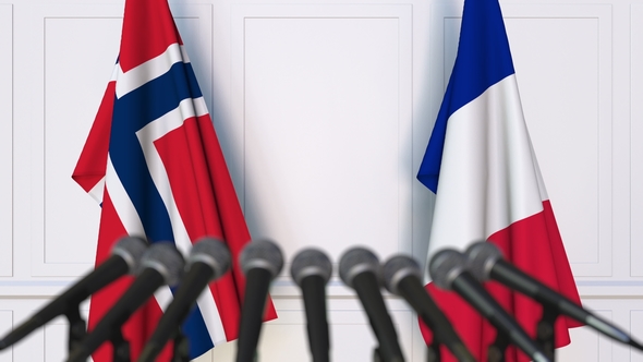 Flags of Norway and France at International Press Conference alt