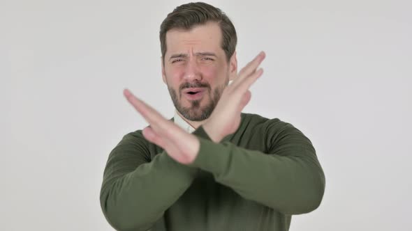 Portrait of Man Showing No Sign By Arm Gesture White Screen