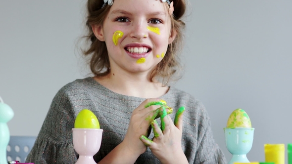 Cute Little Girl Painting Colorful Easter Eggs She Dirty Her Hands and Face