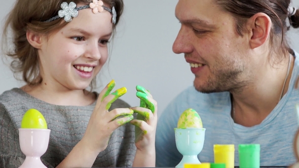 The Daughter and Father Paint Easter Eggs The Girl Dirty Her Dad with Paint They Laugh Fun