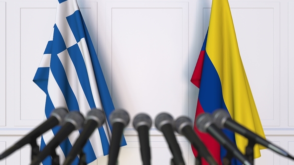 Flags of Greece and Colombia at International Press Conference alt