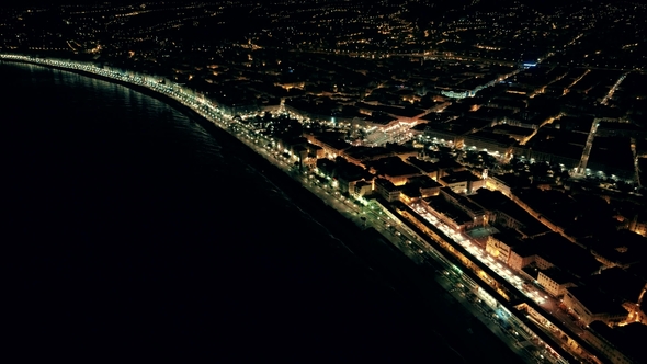 Night Aerial View of Illuminated Nice Town in France Flight Over Promenade