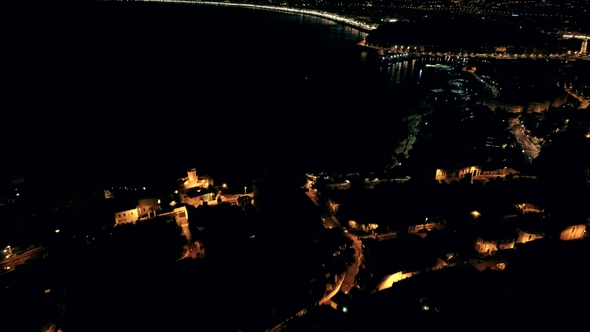 Night Aerial View of Illuminated Nice Town in France. Drone Flight Over Typical Houses