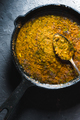 Preparation of curry paste in a cast-iron frying pan closeup. Indian food - PhotoDune Item for Sale