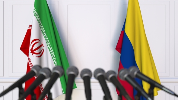 Flags of Iran and Colombia at International Press Conference alt