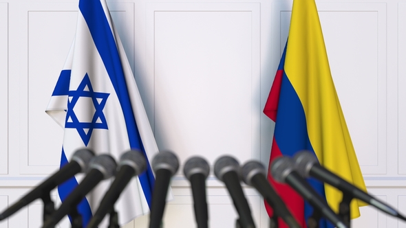 Flags of Israel and Colombia at International Press Conference alt