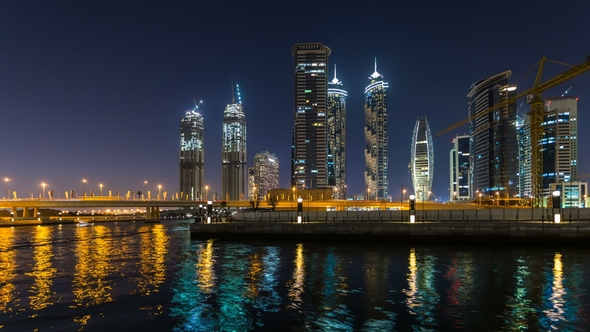 Panoramic View of Dubai Business Bay at Night, Reflection of the Lights in Dubai Creek Dubai, UAE