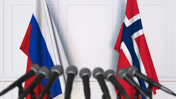 Flags of Russia and Norway at International Press Conference alt