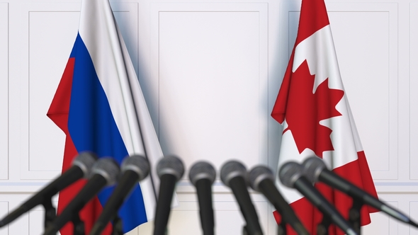 Flags of Russia and Canada at International Press Conference alt