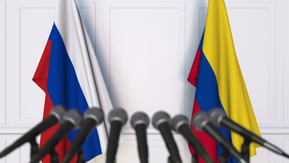 Flags of Russia and Colombia at International Press Conference alt