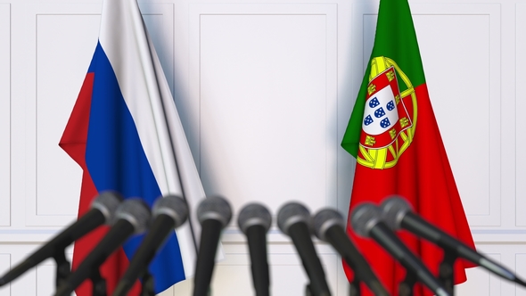 Flags of Russia and Portugal at International Press Conference alt