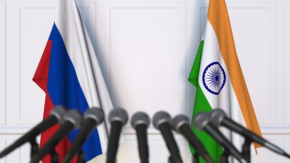 Flags of Russia and India at International Press Conference alt