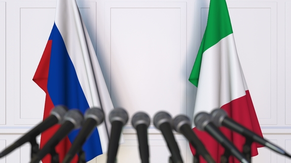 Flags of Russia and Italy at International Press Conference alt