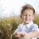 Adorable Little Kid Standing in the Middle of Field, Plays with Natural Wheat Spike. Having Fun - VideoHive Item for Sale