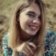 View of a Beautiful Girl in a Traditional Embroidered Shirt Sitting on a Stack of Hay - VideoHive Item for Sale