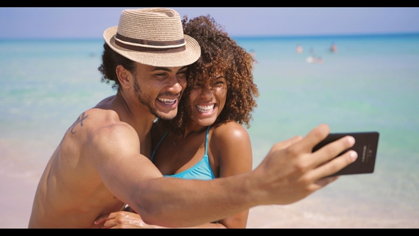 Cheerful Happy Couple Selfies on Beach