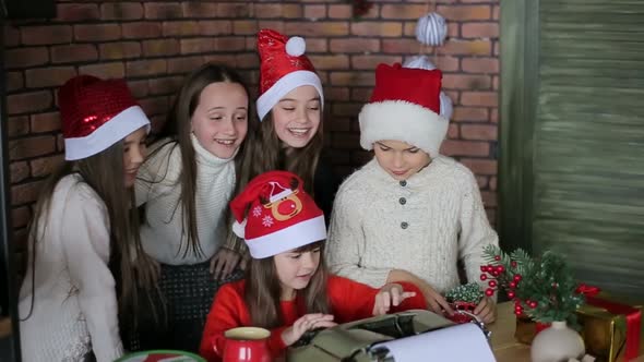 Little children sitting on authentic Santa Claus