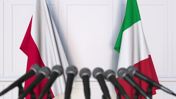 Flags of Poland and Italy at International Press Conference alt
