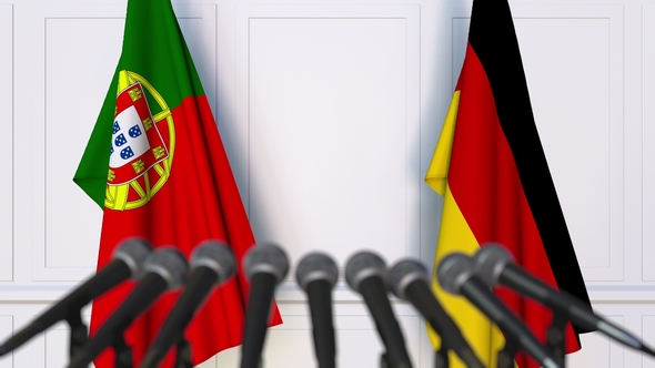 Flags of Portugal and Germany at International Press Conference alt